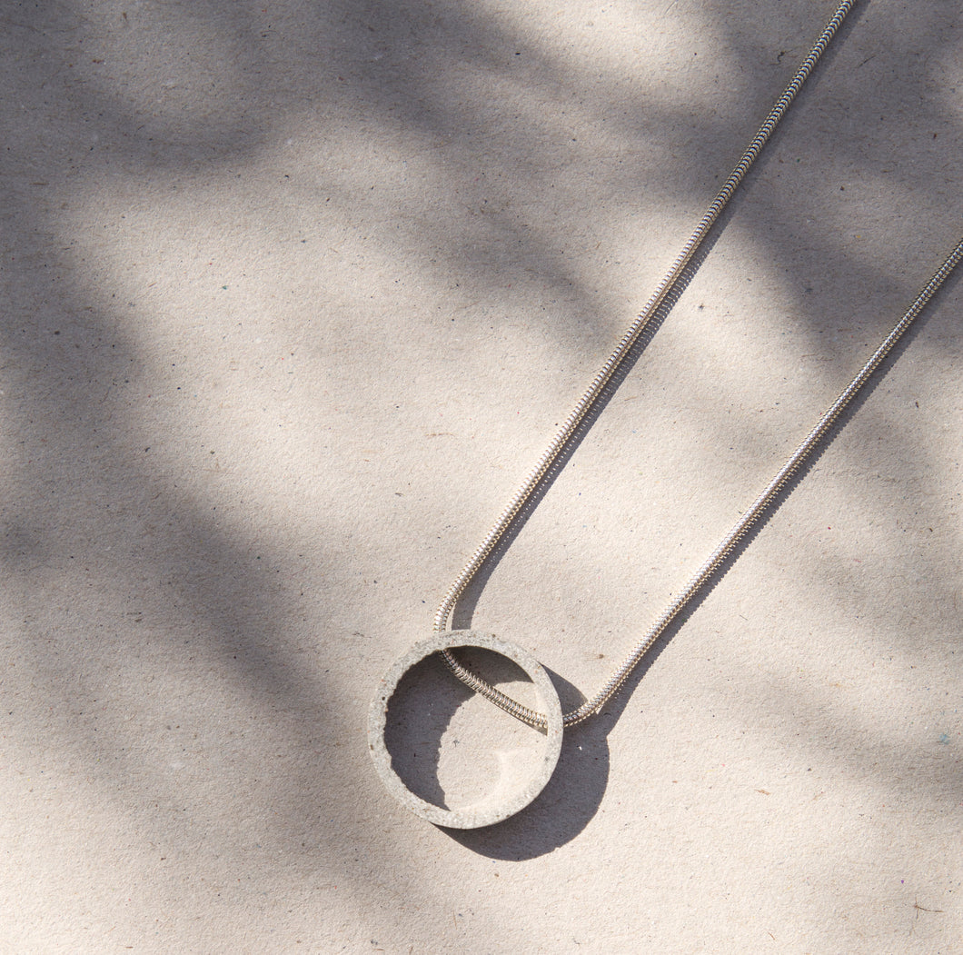 CIRCULAR concrete and silver necklace